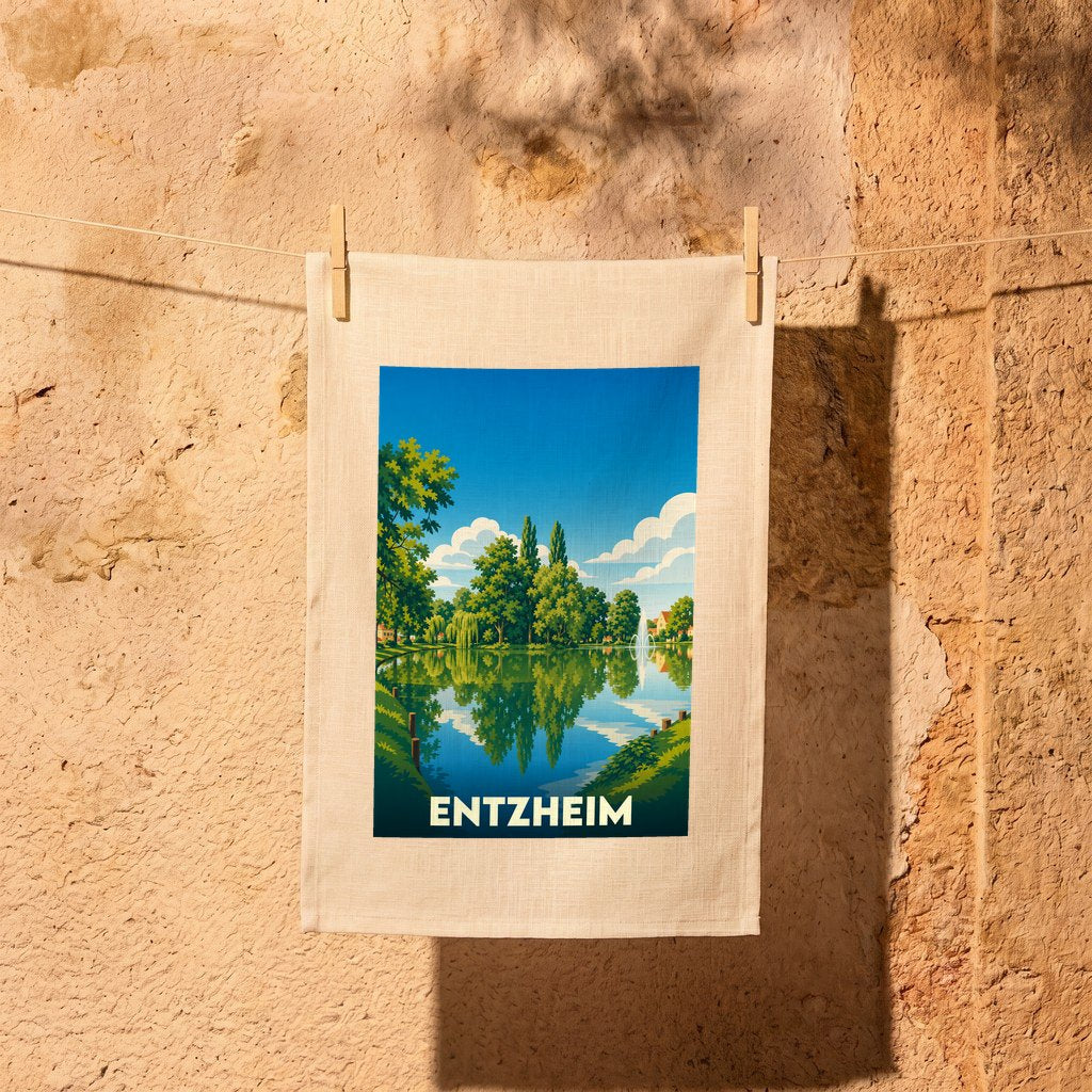Torchon souvenir de la ville d'Entzheim avec une illustration stylisée d'un plan d'eau arboré.