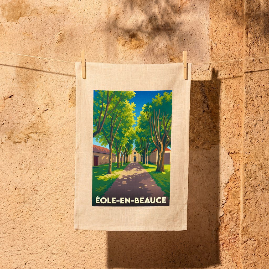Torchon souvenir de la ville d'Éole-en-Beauce avec une illustration stylisée d'une allée arborée.