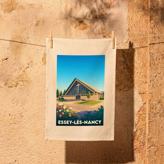 Torchon souvenir de la ville de Essey-lès-Nancy avec une illustration stylisée de son église moderne.