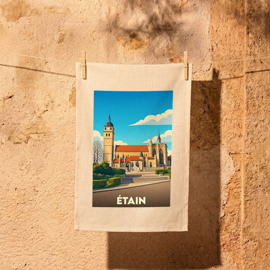 Torchon souvenir de la ville d'Étain avec une illustration stylisée de son église et de son clocher.