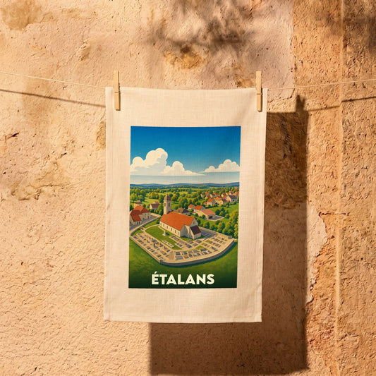 Torchon souvenir de la ville d'Étalans avec une illustration stylisée de son église et de ses paysages.