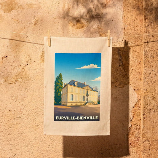 Torchon souvenir de la ville de Eurville-Bienville avec une illustration stylisée d'un château.