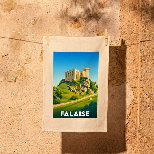 Torchon souvenir de la ville de Falaise illustrant son château médiéval sur un éperon rocheux.