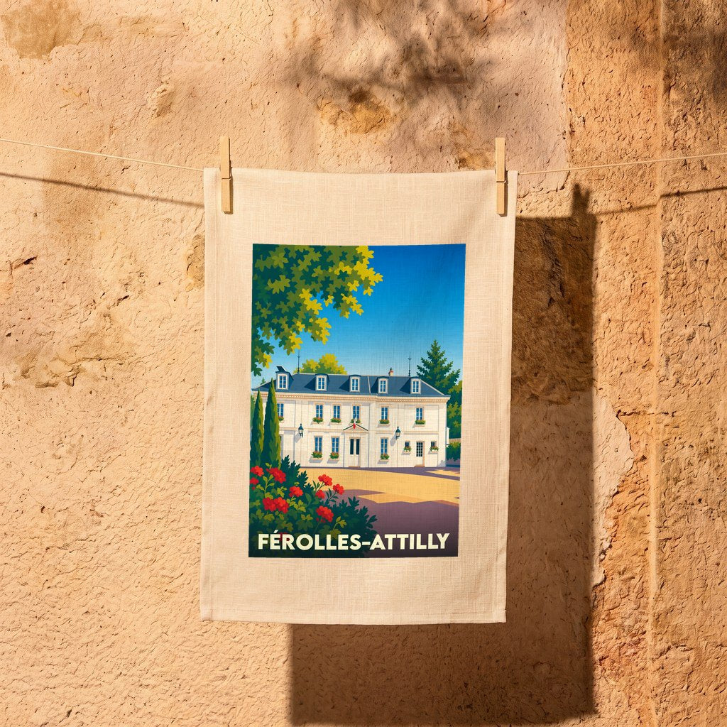 Torchon souvenir de la ville de Férolles-Attilly avec une illustration stylisée de son hôtel de ville.