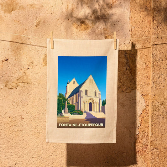 Torchon souvenir de la ville de Fontaine-Étoupefour avec une illustration stylisée de son église.