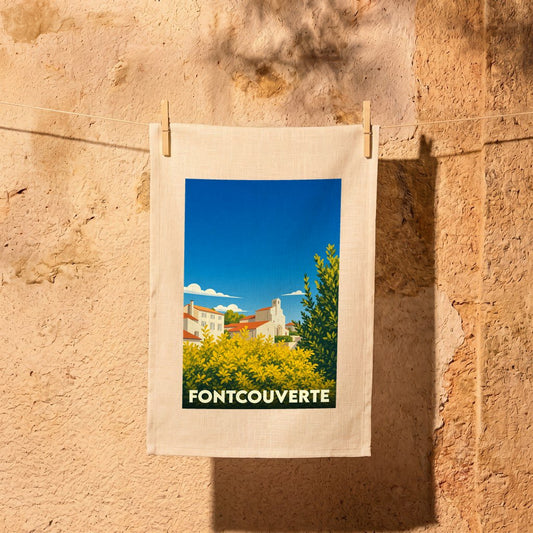 Torchon souvenir de la ville de Fontcouverte illustré d'un paysage stylisé.