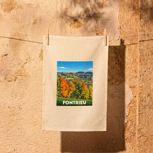 Torchon souvenir de la ville de Fontrieu avec une illustration automnale stylisée.