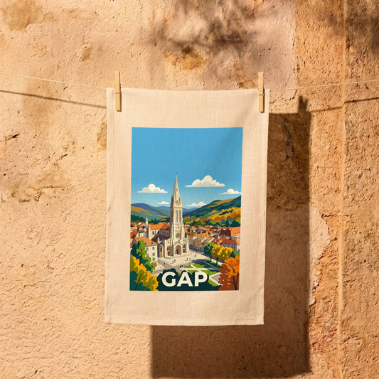 Torchon souvenir de la ville de Gap avec une illustration stylisée de sa cathédrale et des montagnes environnantes.