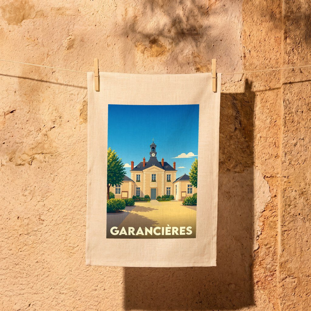 Torchon souvenir de la ville de Garancières avec une illustration stylisée de sa mairie.