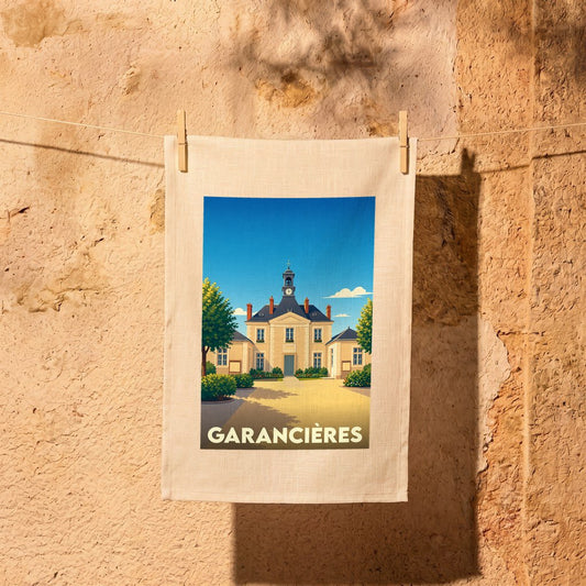 Torchon souvenir de la ville de Garancières avec une illustration stylisée de sa mairie.