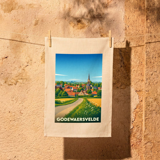 Torchon souvenir de la ville de Godewaersvelde avec une illustration stylisée de son paysage rural et de son église.