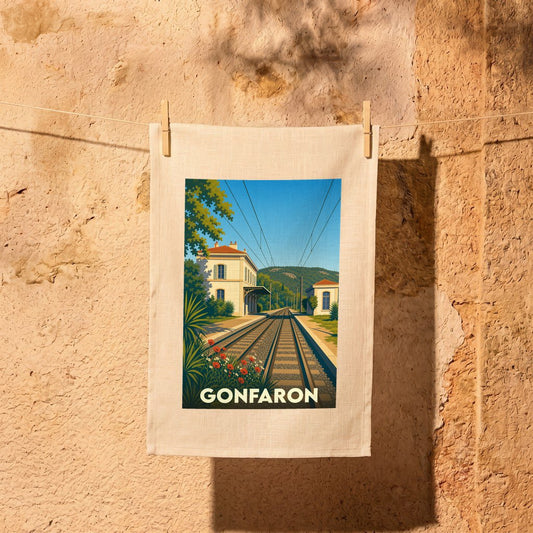 Torchon souvenir de la ville de Gonfaron illustré d'un paysage ferroviaire vintage et stylisé.
