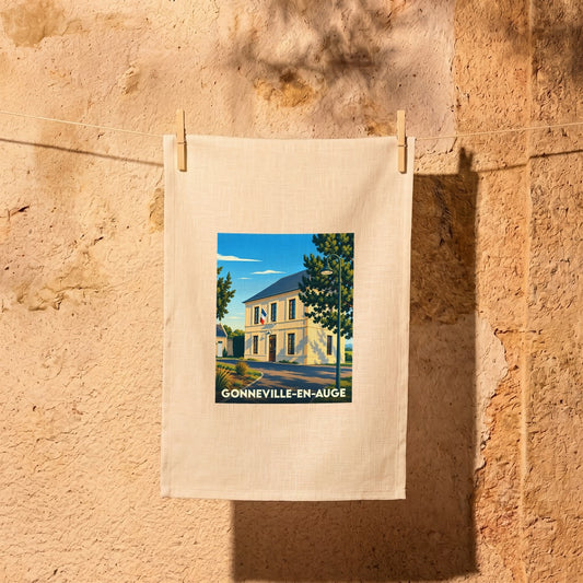 Torchon souvenir de la ville de Gonneville-en-Auge avec une illustration stylisée d'un bâtiment officiel.