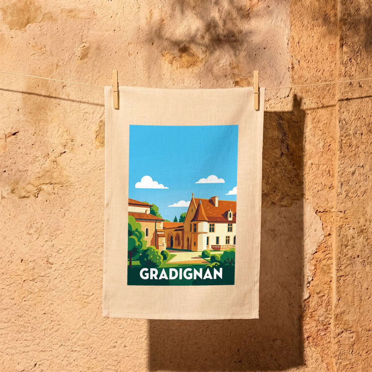 Torchon souvenir de la ville de Gradignan avec une illustration stylisée de ses bâtiments historiques.