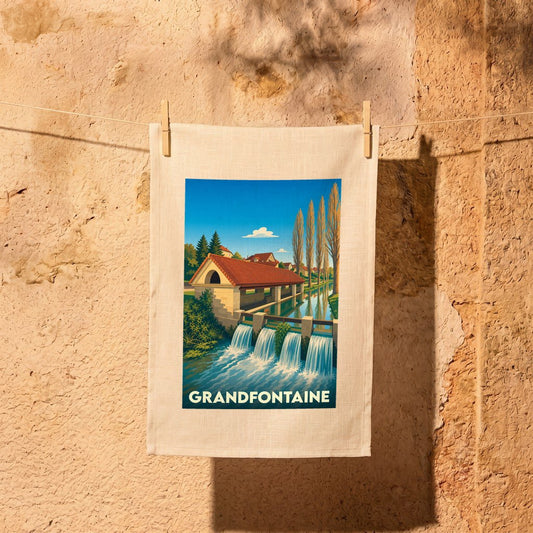 Torchon souvenir de la ville de Grandfontaine avec une illustration stylisée.