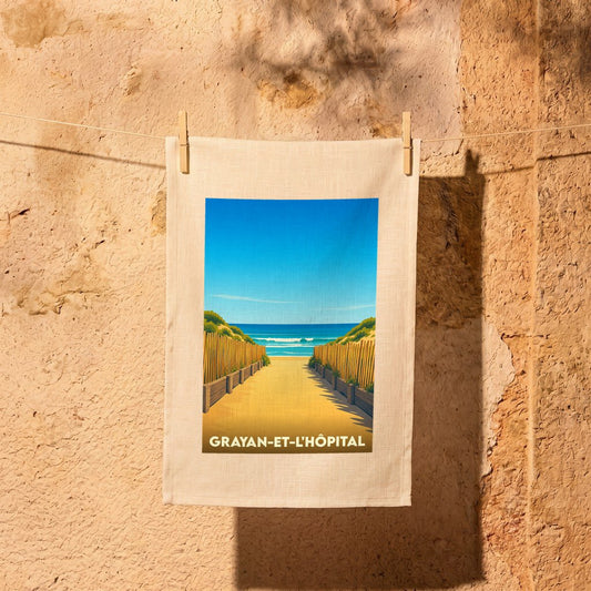 Torchon souvenir de la ville de Grayan-et-l'Hôpital avec une illustration stylisée d'un accès à la plage.