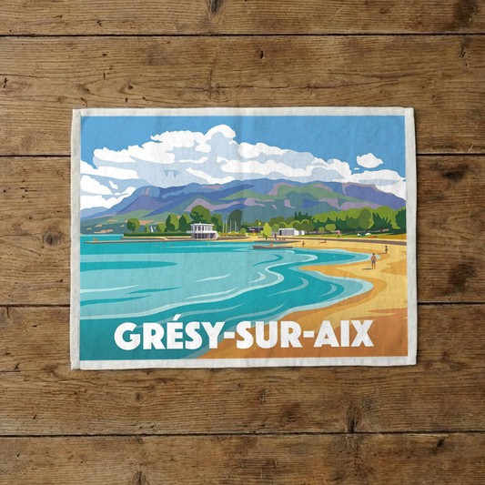 Torchon souvenir de la ville de Grésy-sur-Aix avec une illustration stylisée d'un paysage de lac et de montagnes.