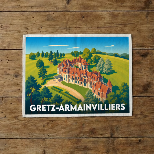Torchon souvenir de la ville de Gretz-Armainvilliers avec une illustration stylisée d'un château.