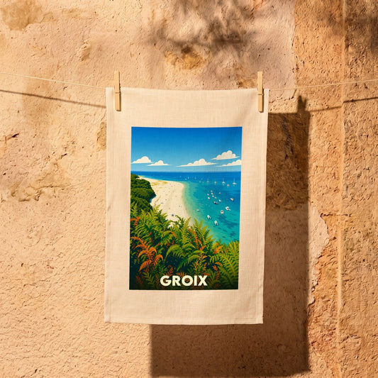 Torchon souvenir de l'île de Groix avec une illustration stylisée d'une plage bordée de fougères.