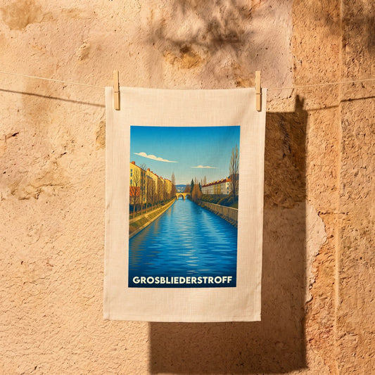 Torchon souvenir de la ville de Grosbliederstroff avec une illustration stylisée d'un canal.