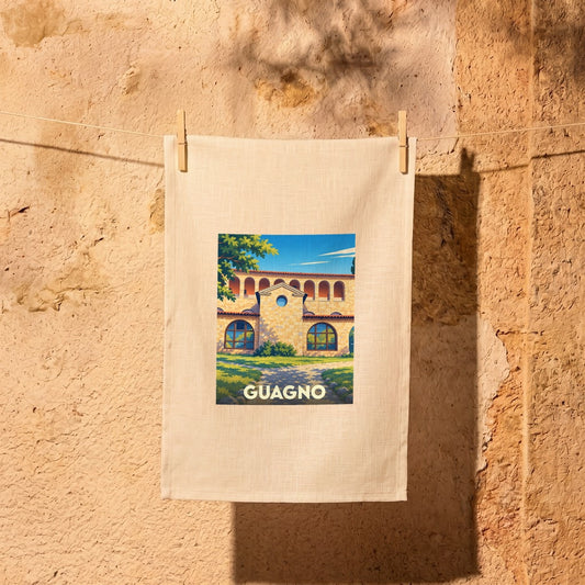 Torchon souvenir de la ville de Guagno orné d'une illustration stylisée de son architecture.