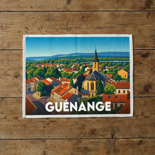 Torchon souvenir de la ville de Guénange avec une illustration stylisée.