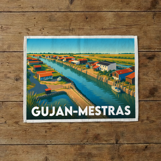 Torchon souvenir de la ville de Gujan-Mestras avec une illustration stylisée de ses cabanes ostréicoles.