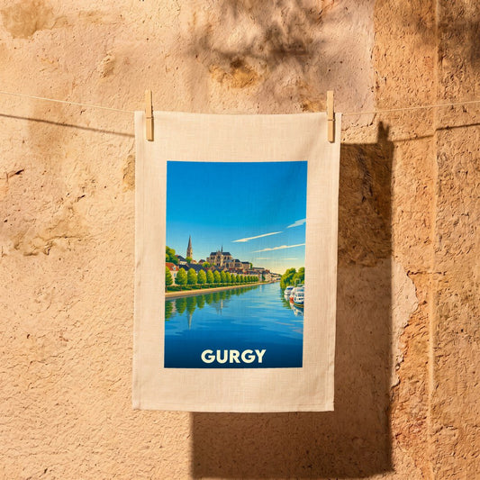 Torchon souvenir de la ville de Gurgy illustré d'un paysage urbain au bord de l'eau.