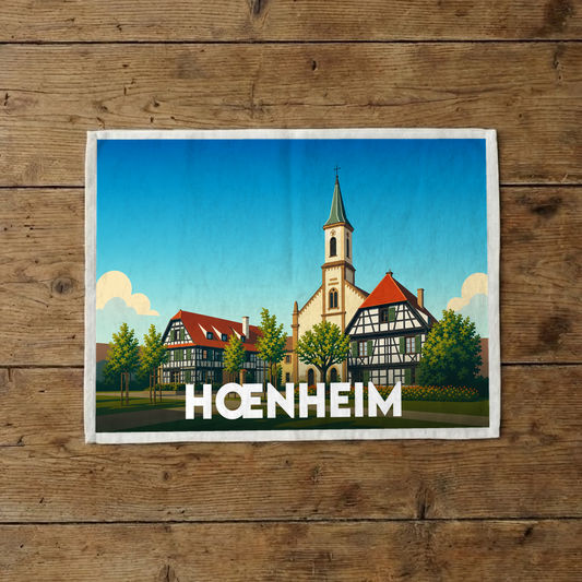 Torchon souvenir de la ville de Hœnheim avec une illustration stylisée de son architecture traditionnelle.