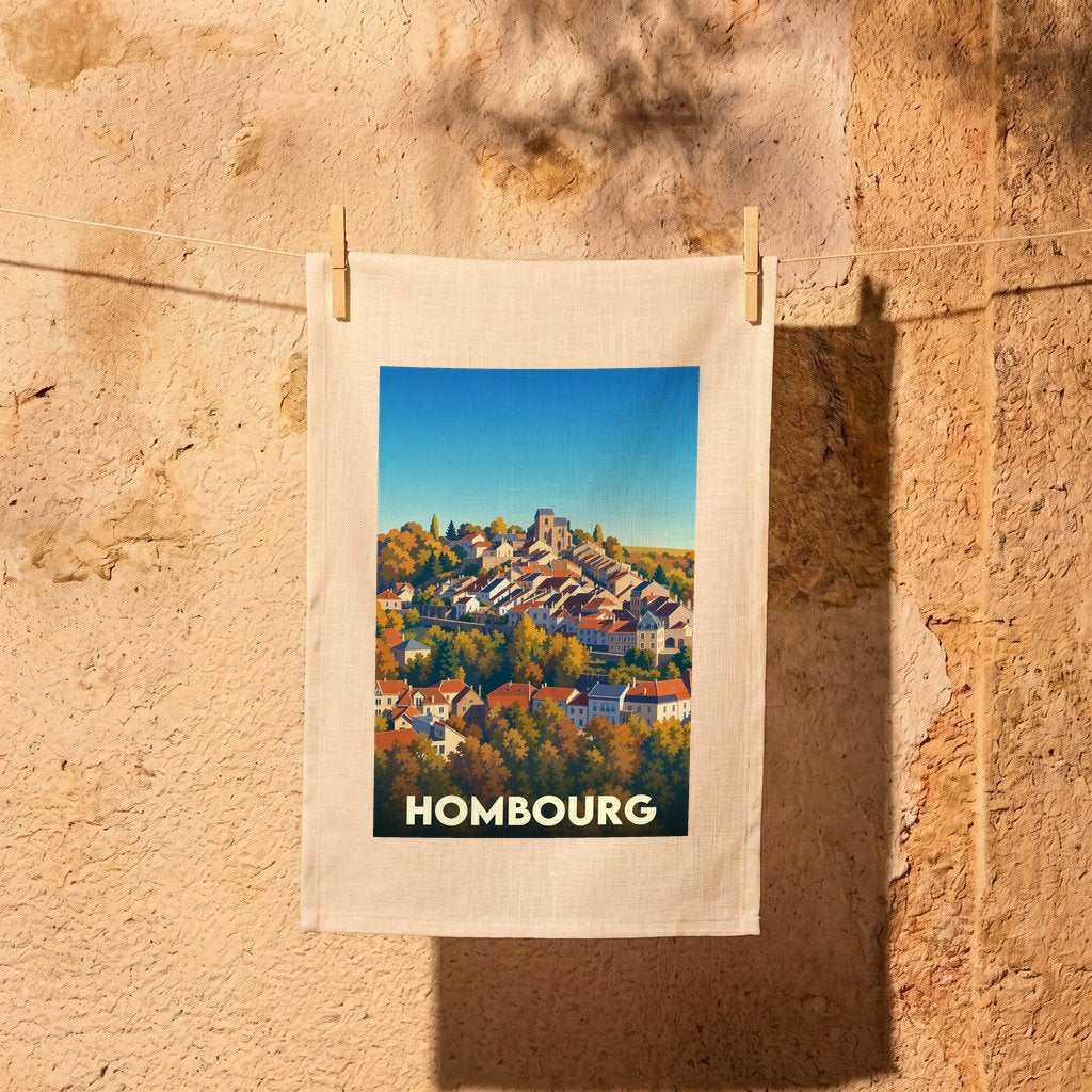 Torchon souvenir de la ville de Hombourg illustré d'une vue panoramique stylisée sur les toits et le clocher.