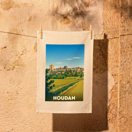 Torchon souvenir de la ville de Houdan avec une illustration stylisée d'un paysage champêtre.