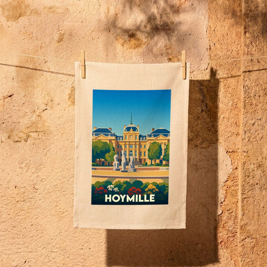 Torchon souvenir de la ville de Hoymille illustré d'un bâtiment historique et de jardins stylisés.