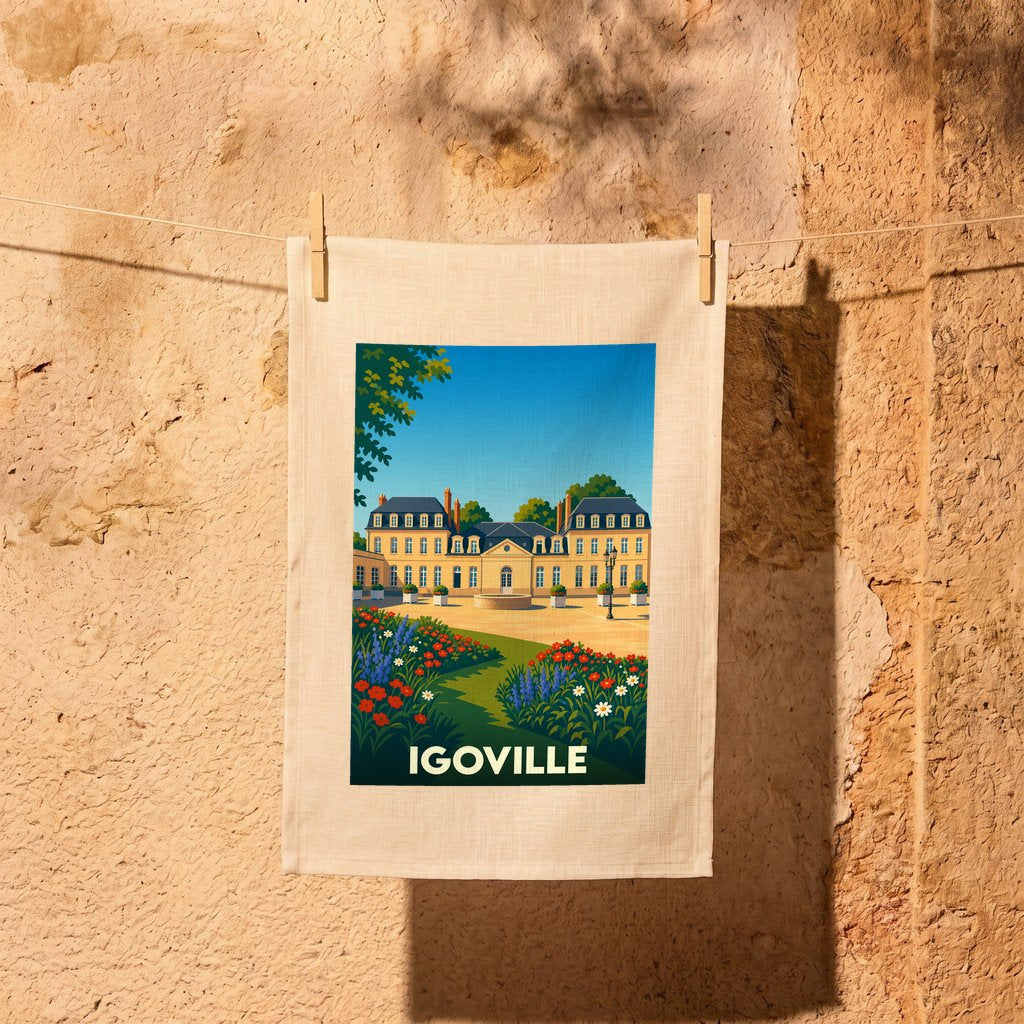 Torchon souvenir de la ville d'Igoville avec une illustration stylisée d'un château et de son jardin fleuri.