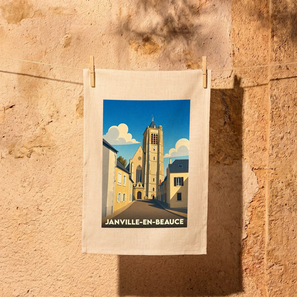 Torchon souvenir de la ville de Janville-en-Beauce avec une illustration stylisée de son église.