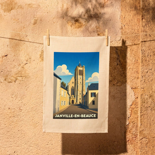Torchon souvenir de la ville de Janville-en-Beauce avec une illustration stylisée de son église.