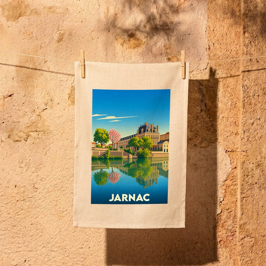 Torchon souvenir de la ville de Jarnac avec une illustration stylisée d'un paysage fluvial.