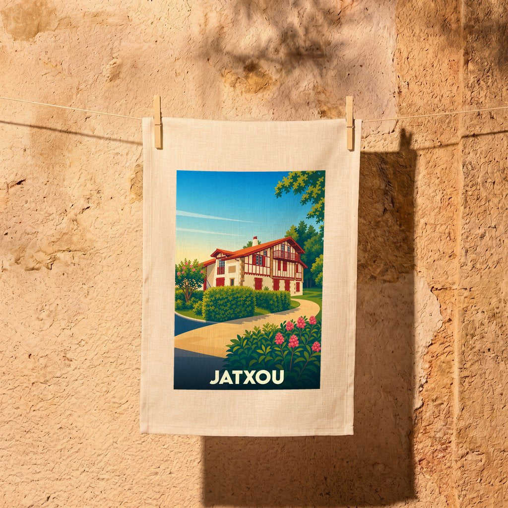 Torchon souvenir de la ville de Jatxou avec une illustration stylisée d'une maison basque traditionnelle.