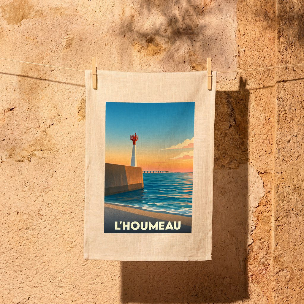 Torchon souvenir de la ville de L'Houmeau avec une illustration stylisée de son phare au coucher du soleil.