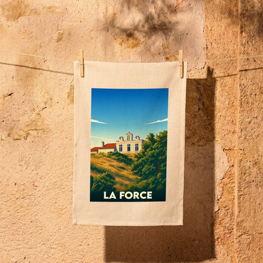 Torchon souvenir de la ville de La Force avec une illustration stylisée d'un bâtiment sur une colline.