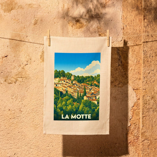 Torchon souvenir de la ville de La Motte avec une illustration stylisée d'un village provençal.