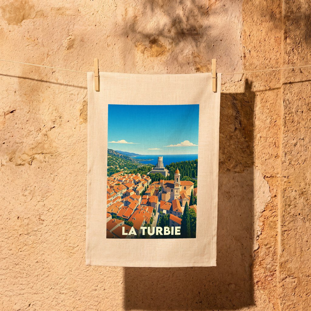 Torchon souvenir de la ville de La Turbie avec une illustration stylisée.