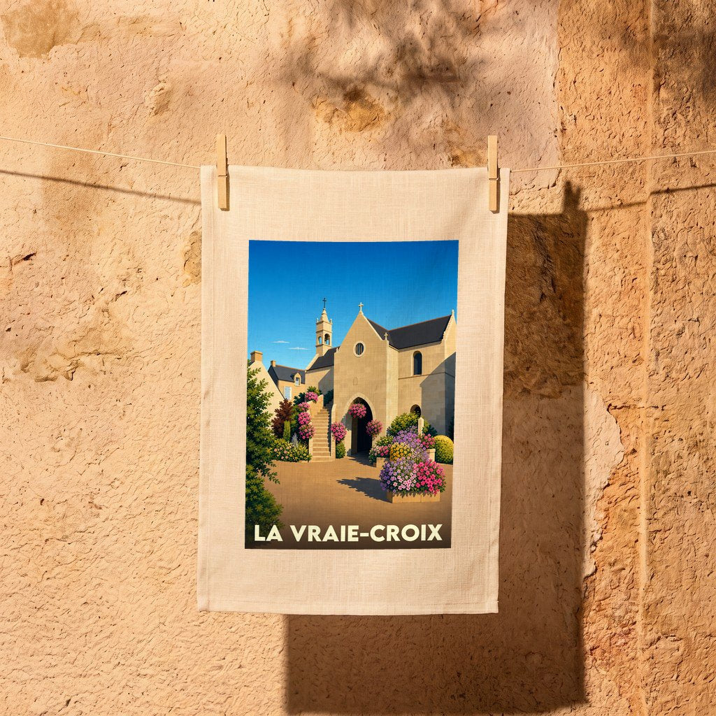 Torchon souvenir de la ville de La Vraie-Croix avec une illustration stylisée.