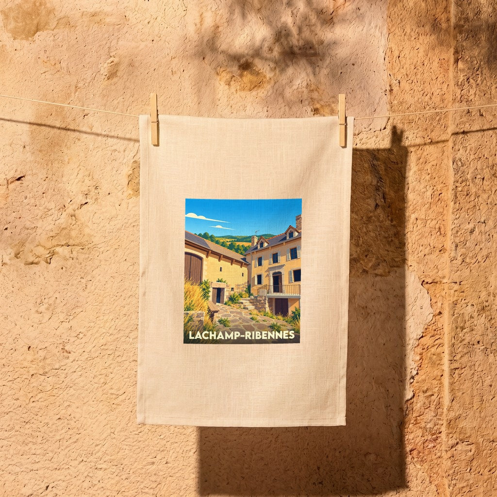 Torchon souvenir de la ville de Lachamp-Ribennes avec une illustration stylisée.