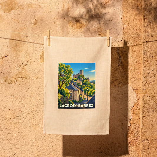 Torchon souvenir de la ville de Lacroix-Barrez avec une illustration stylisée d'un village médiéval.