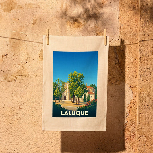 Torchon souvenir de la ville de Laluque avec une illustration stylisée.