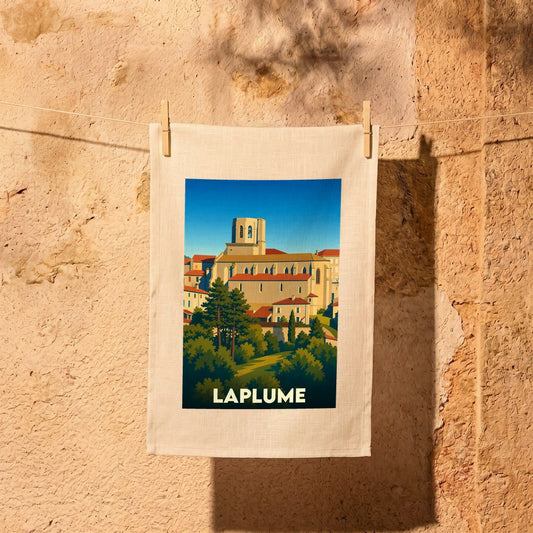Torchon souvenir de la ville de Laplume orné d'une illustration stylisée du village et de son église.