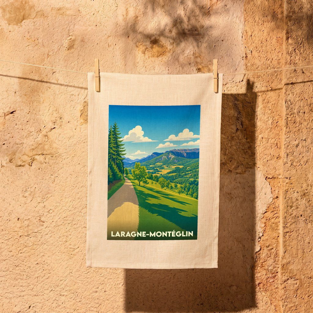 Torchon souvenir de la ville de Laragne-Montéglin avec une illustration stylisée de paysages montagneux.
