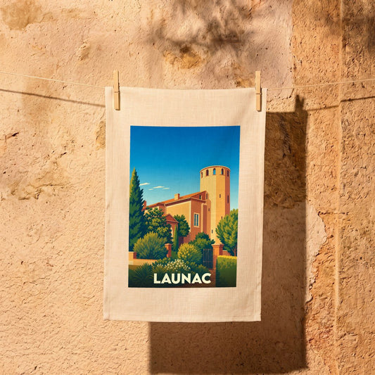 Torchon souvenir de la ville de Launac orné d'une illustration stylisée de son château.
