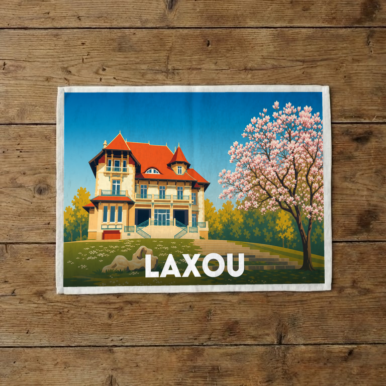 Torchon souvenir de la ville de Laxou avec une illustration colorée d'une villa et d'un arbre en fleurs.