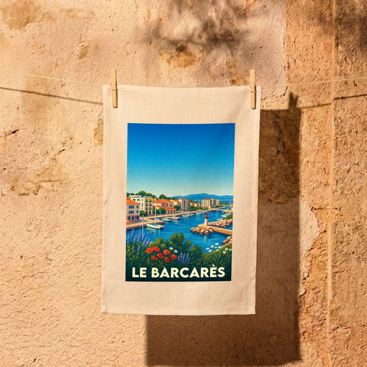 Torchon souvenir de la ville de Le Barcarès avec une illustration stylisée d'un port méditerranéen.